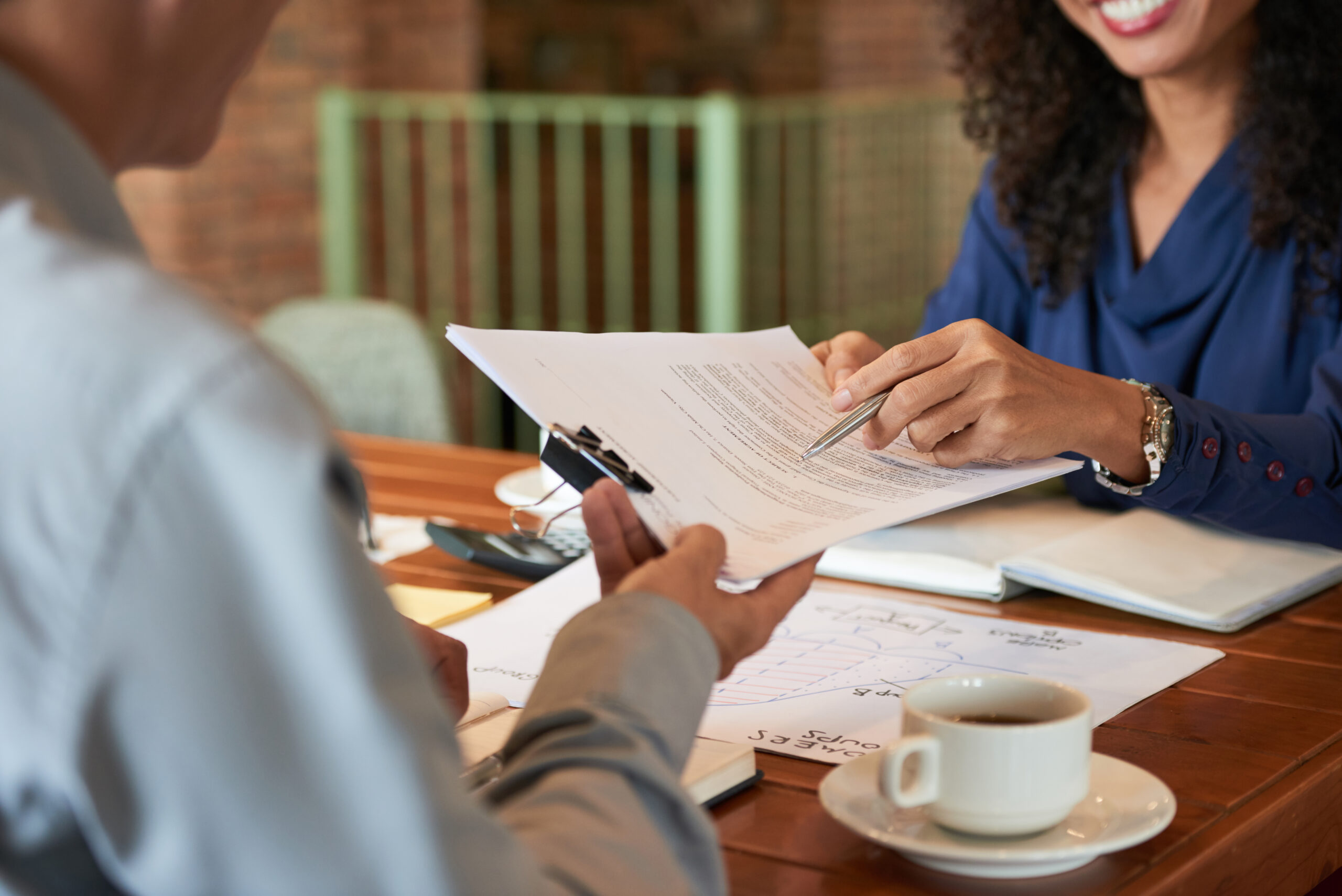 A client consulting with a Los Angeles probate attorney, discussing legal documents to simplify the probate process.
